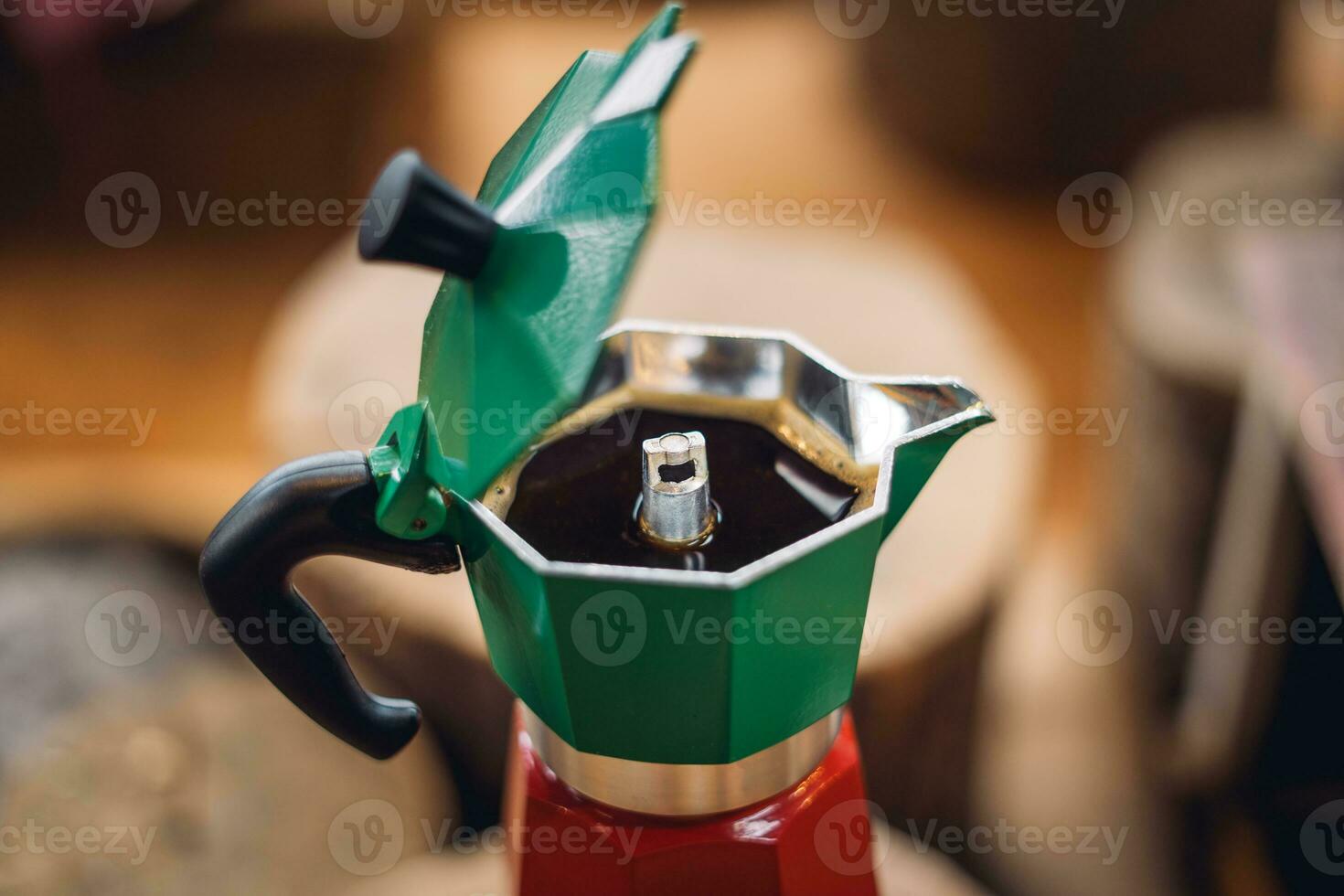 Moka pot coffee on a portable gas stove photo