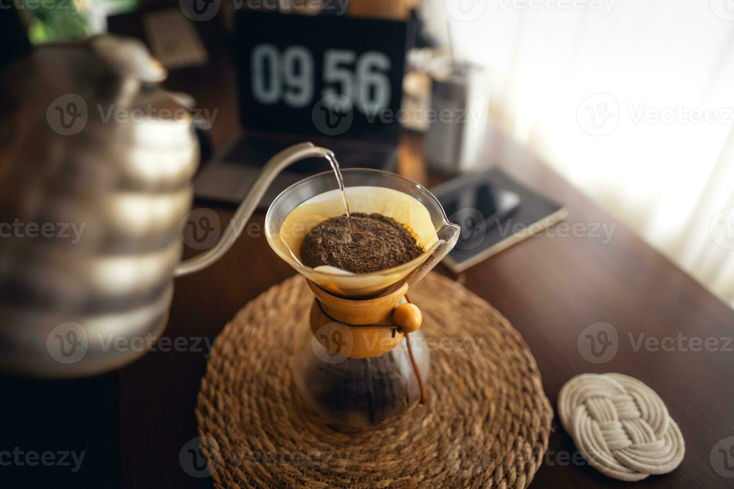 Drip coffee,Pouring water into filter coffee maker photo