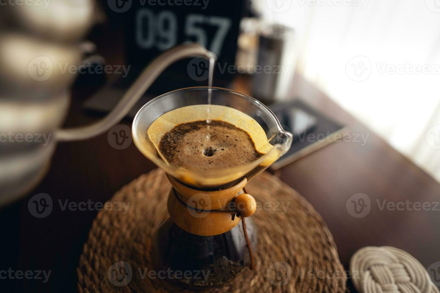 Drip coffee,Pouring water into filter coffee maker photo