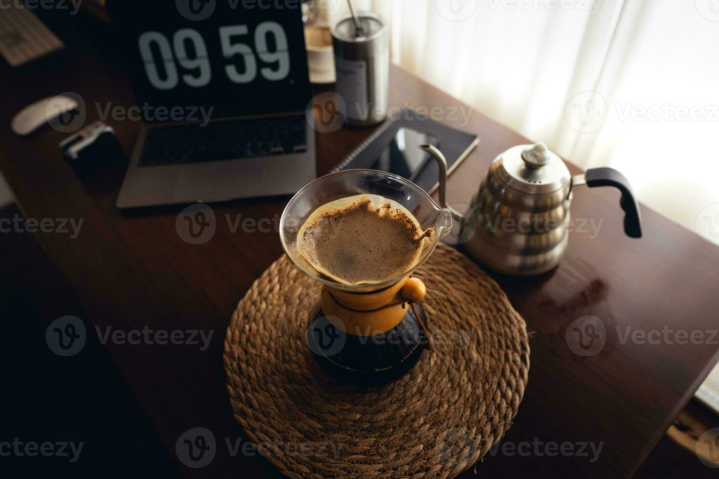 Drip coffee,Pouring water into filter coffee maker photo