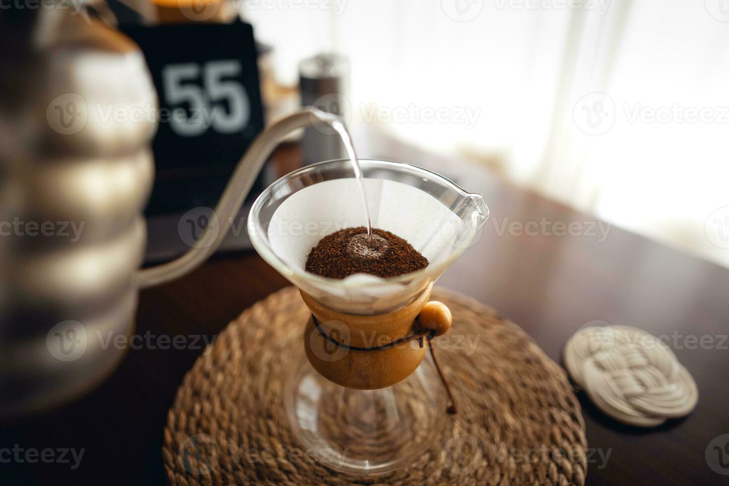 Drip coffee,Pouring water into filter coffee maker photo