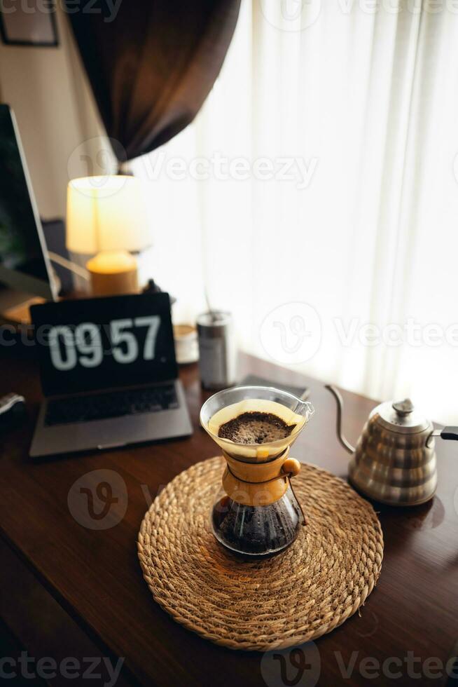 Drip coffee,Pouring water into filter coffee maker photo