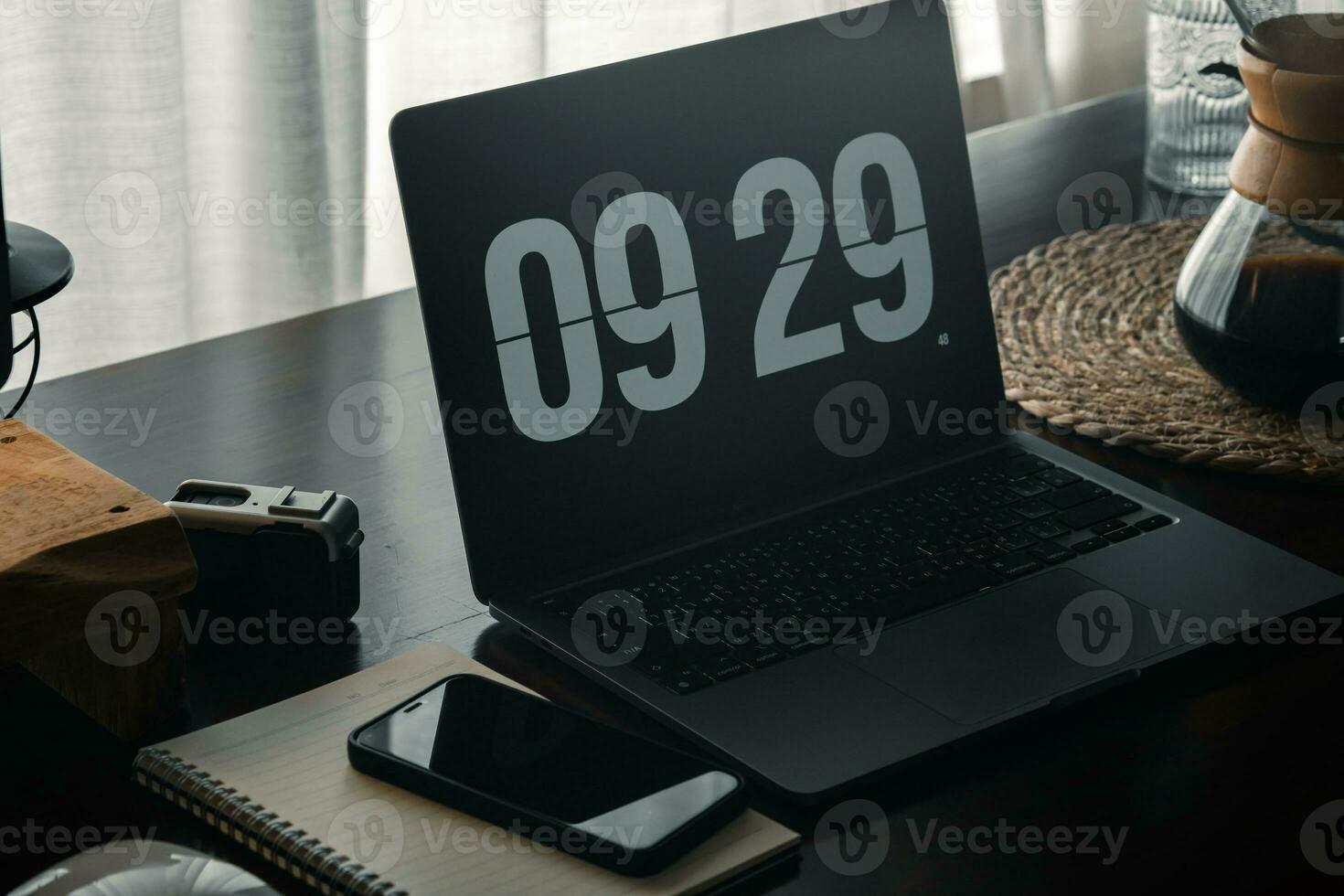 Home computer desk and digital clock on screen photo