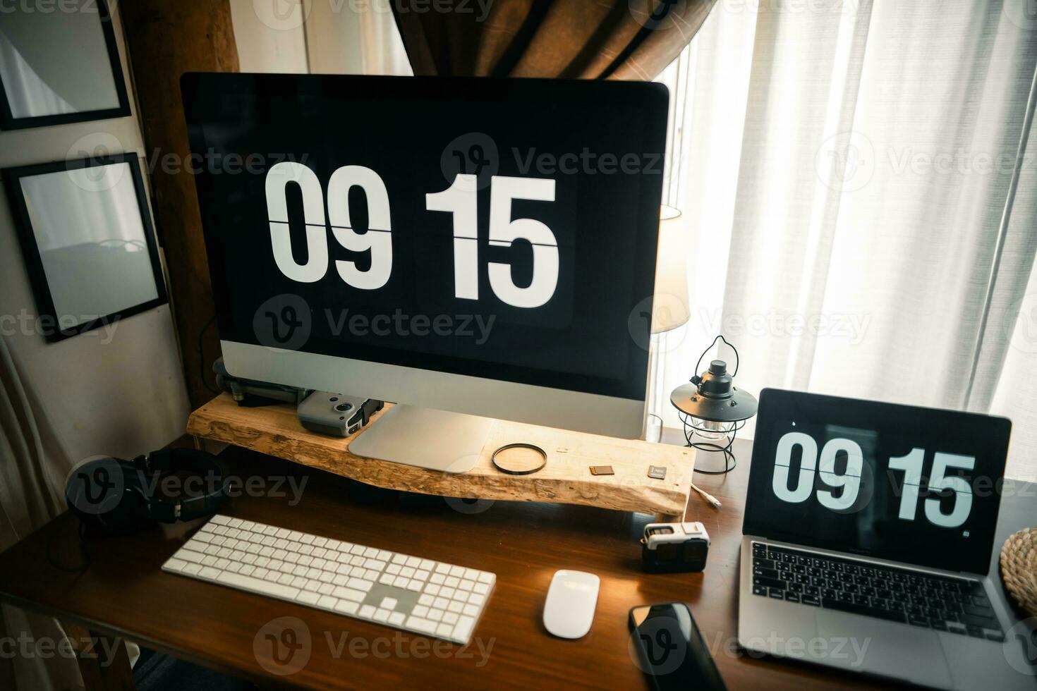 Home computer desk and digital clock on screen photo