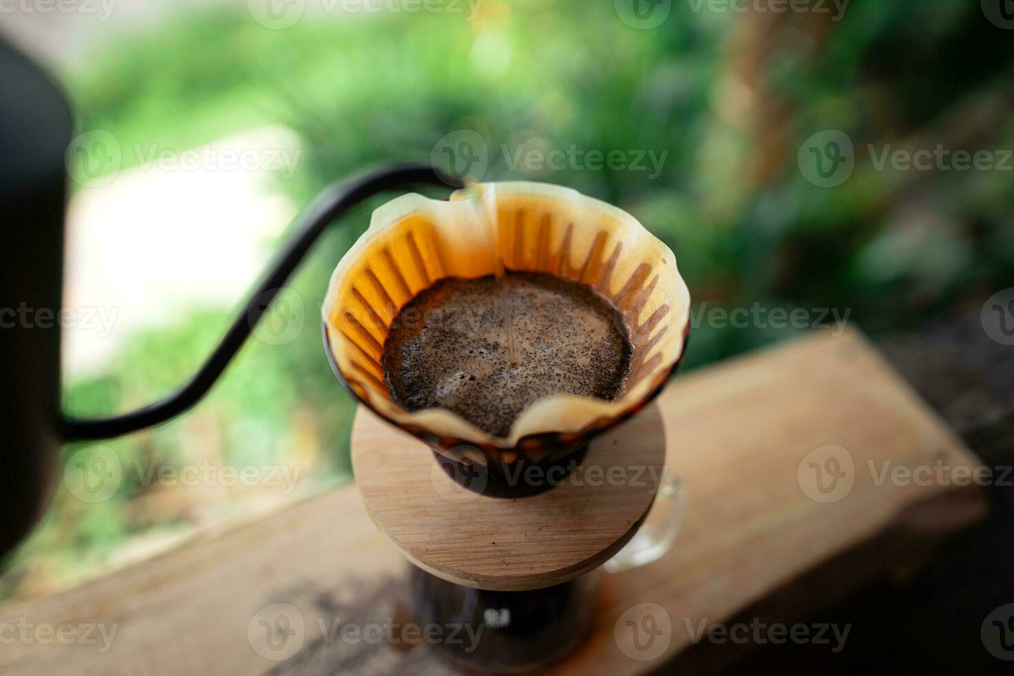 Closeup of hands make coffee at home photo