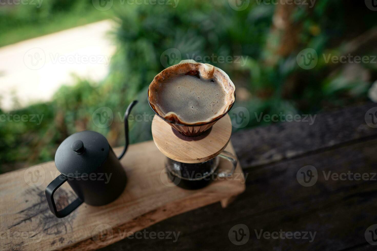 Closeup of hands make coffee at home photo