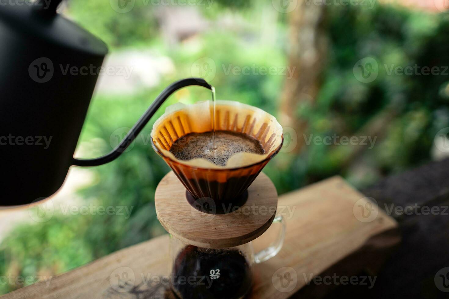 Closeup of hands make coffee at home photo