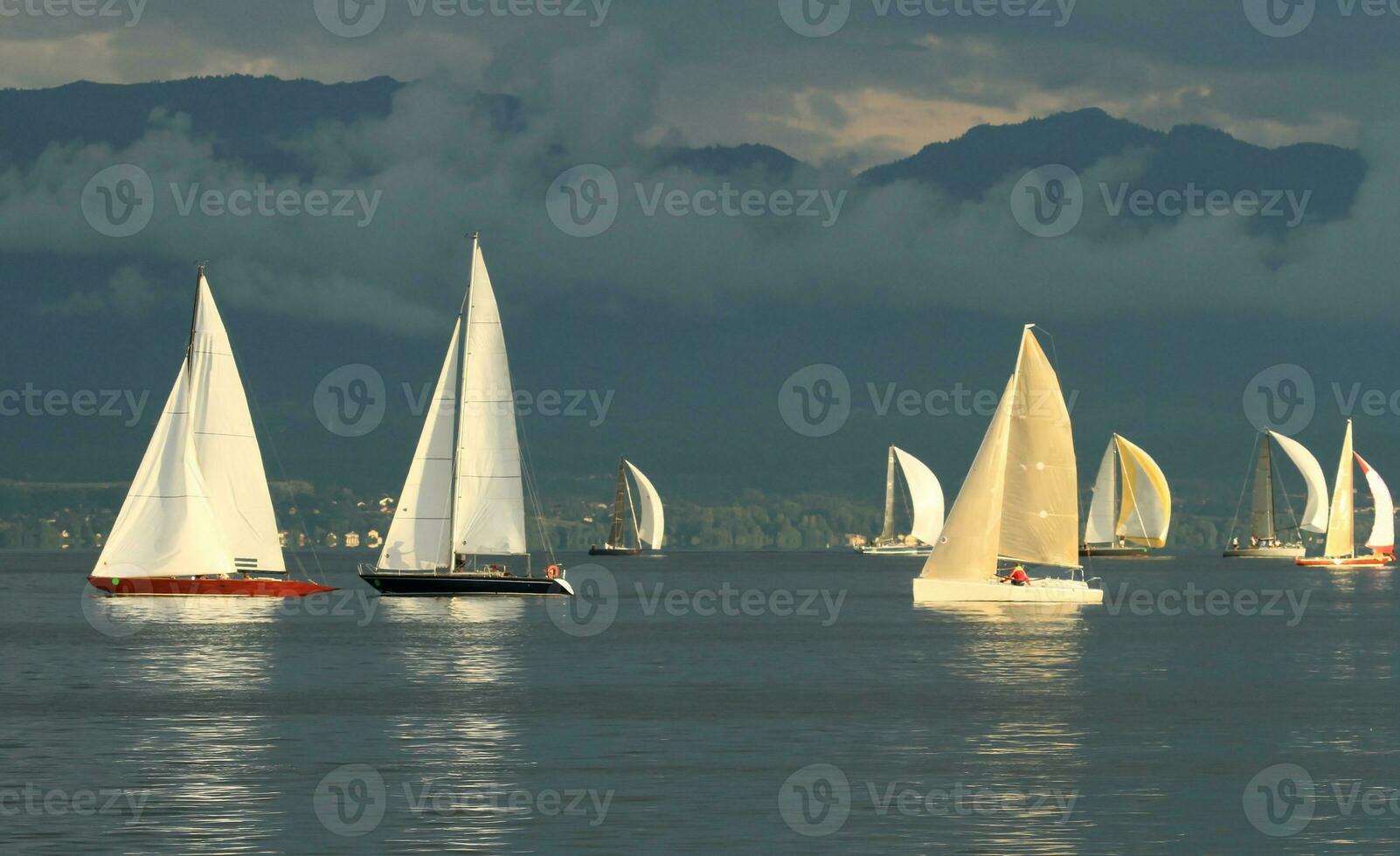 Sailboat race by sunset photo