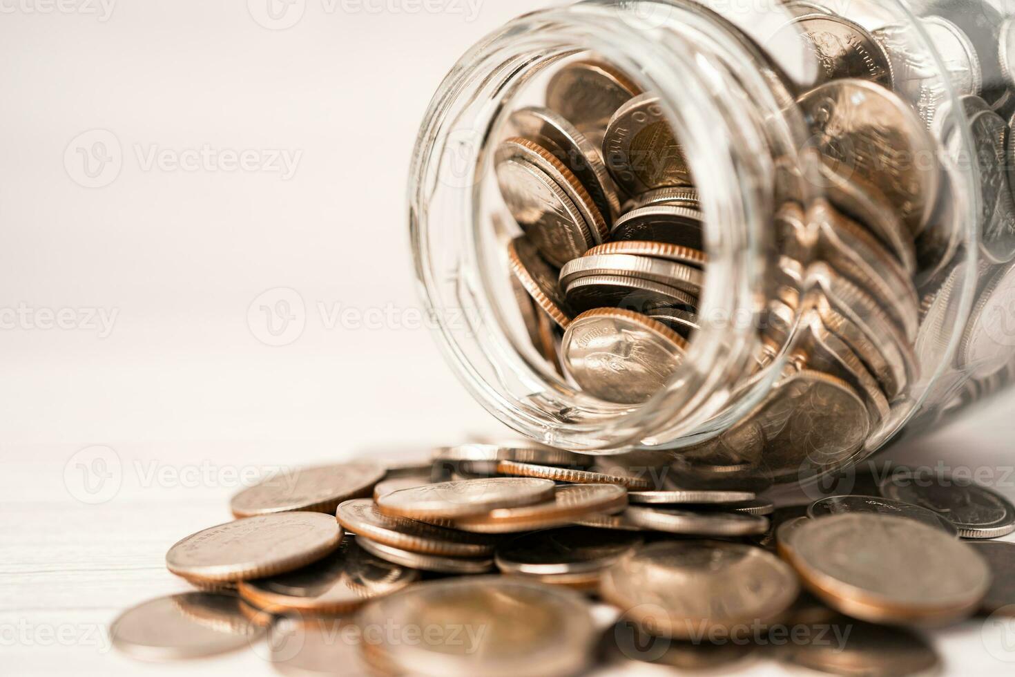 Save money coins in grass jar, Business finance investment concept. photo
