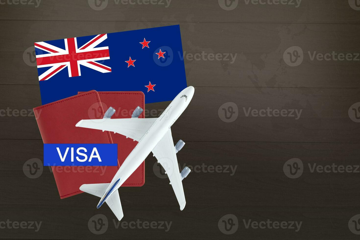 Visa with New Zealand flag, passport, airplane and globe, trip travel immigration. photo