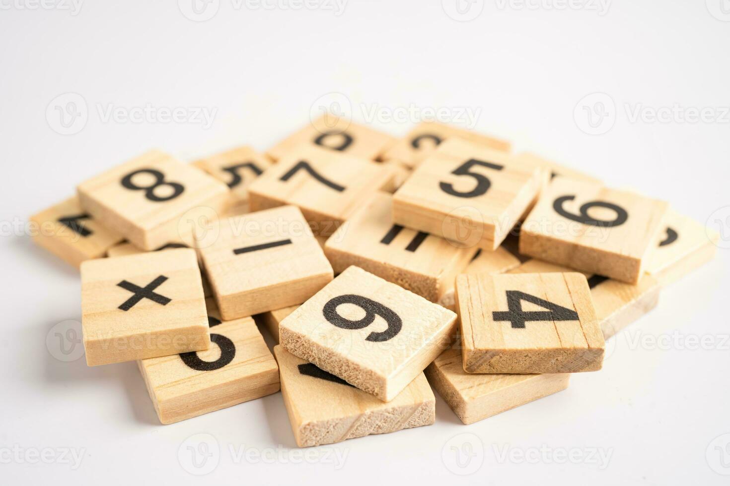 Math number wooden on white background, education study mathematics learning teach concept. photo