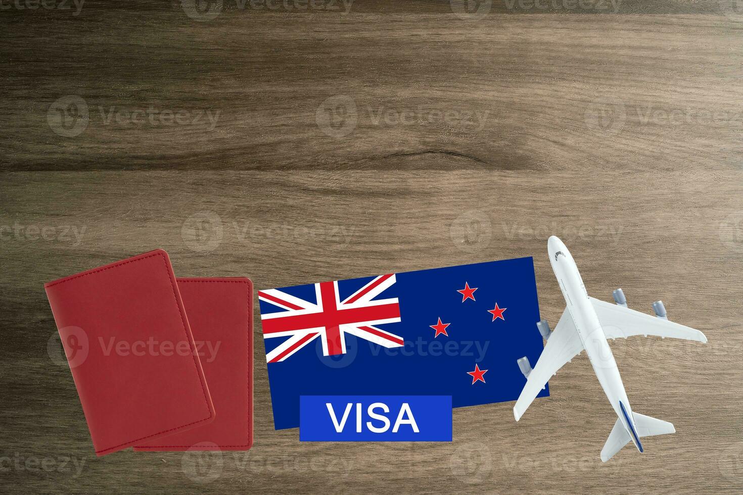 Visa with New Zealand flag, passport, airplane and globe, trip travel immigration. photo
