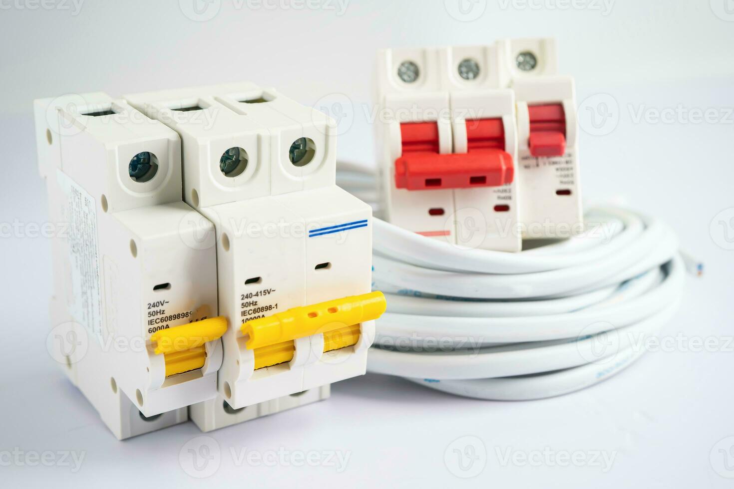 Automatic circuit breaker on white background, control and protect electrical power system. photo