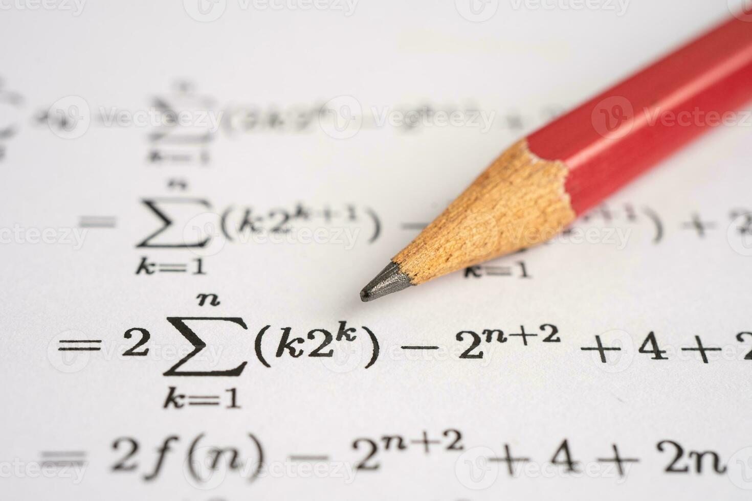 Pencil on mathematic formula exercise test paper in education school. photo