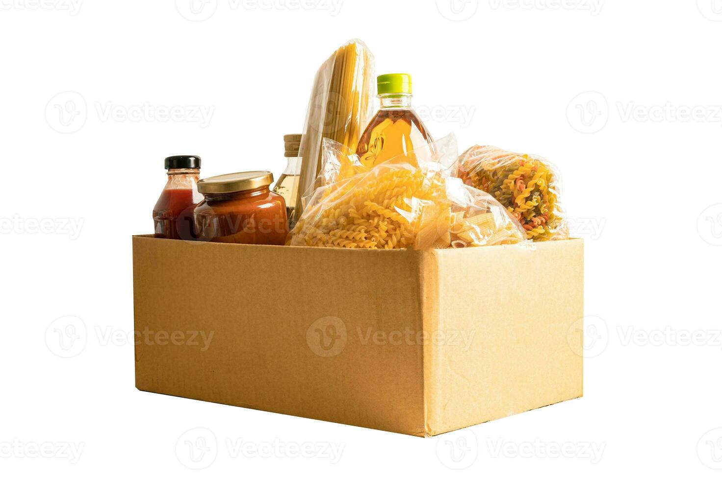 Foodstuff for donation isolated on white background with clipping path, storage and delivery. Various food, pasta, cooking oil and canned food in cardboard box. photo