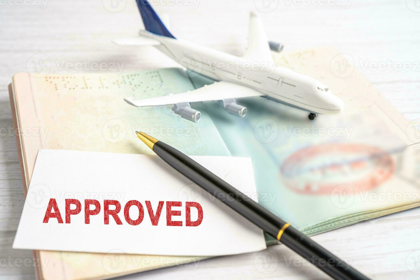 Approved Stamp visa and passport document to immigration at airport in country. photo