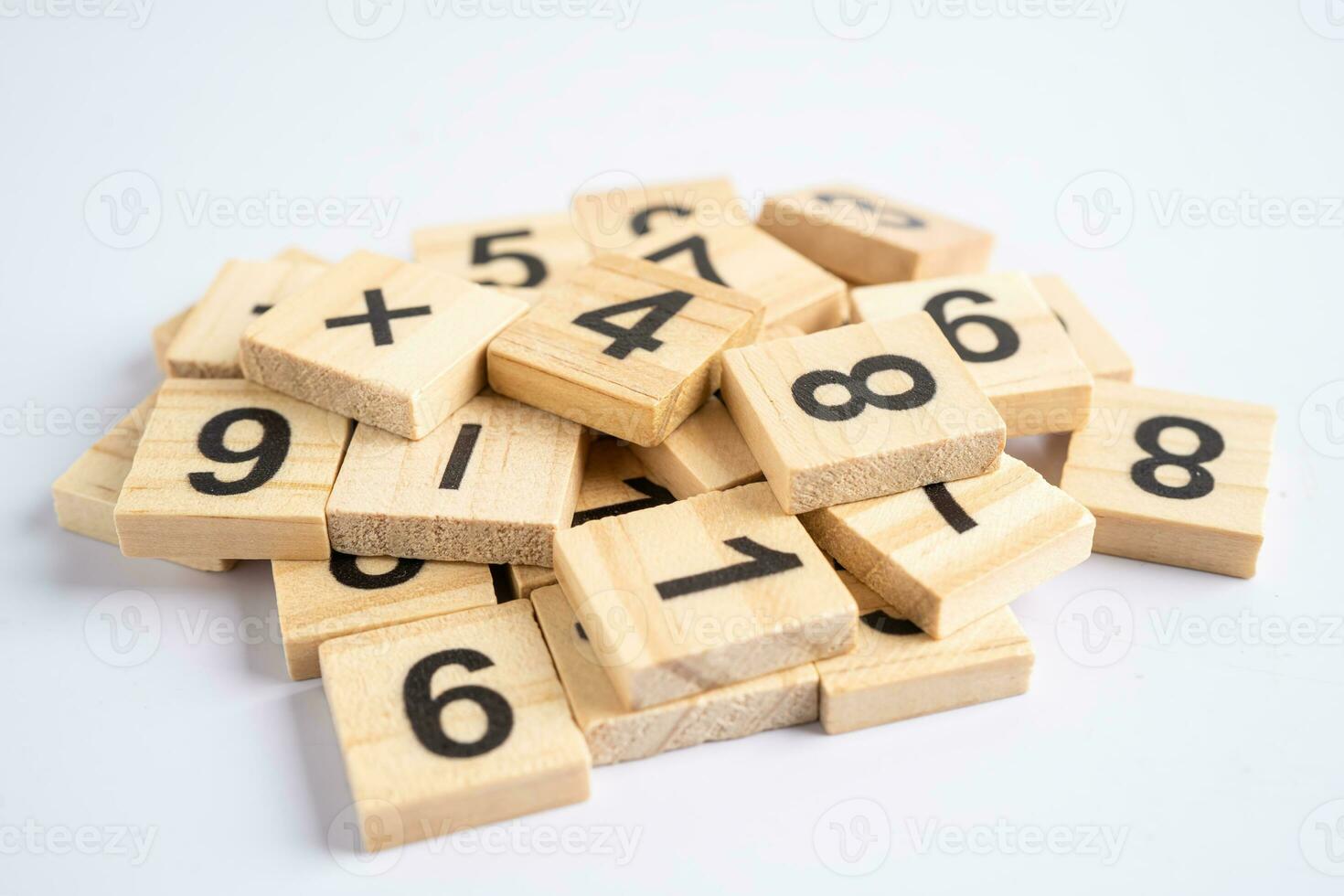 Math number wooden on white background, education study mathematics learning teach concept. photo