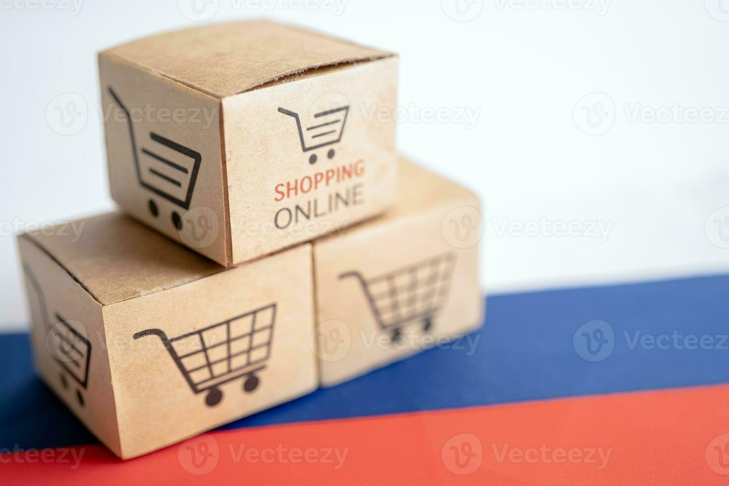 Box with shopping online cart logo and Russia flag, Import Export Shopping online or commerce finance delivery service store product shipping, trade, supplier concept. photo