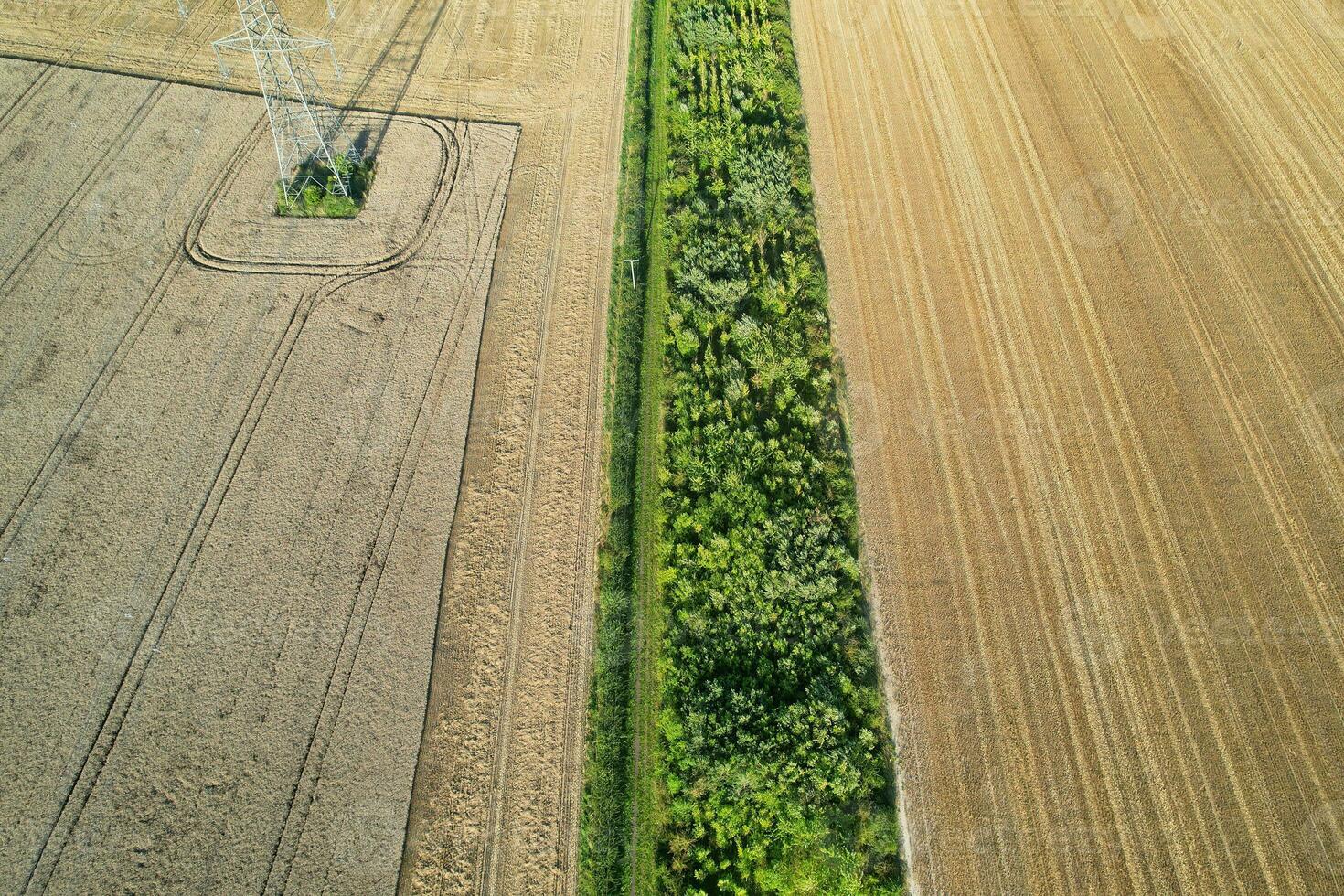 High Angle Panoramic Landscape View of British Agricultural Farms at Countryside Landscape of Sharpenhoe Clappers, Luton City of England UK. Footage Captured on August 19th, 2023 photo