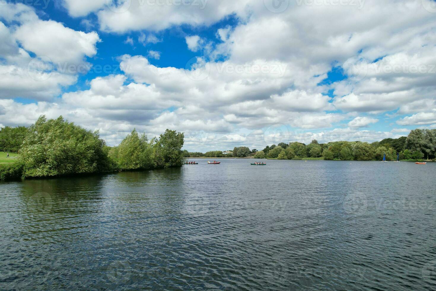 High Angle footage of People are Boating at Caldecotte Lake Located at Milton Keynes City of England Great Britain UK. The Aerial Landscape Was Captured on August 21st, 2023 with Drone's Camera photo