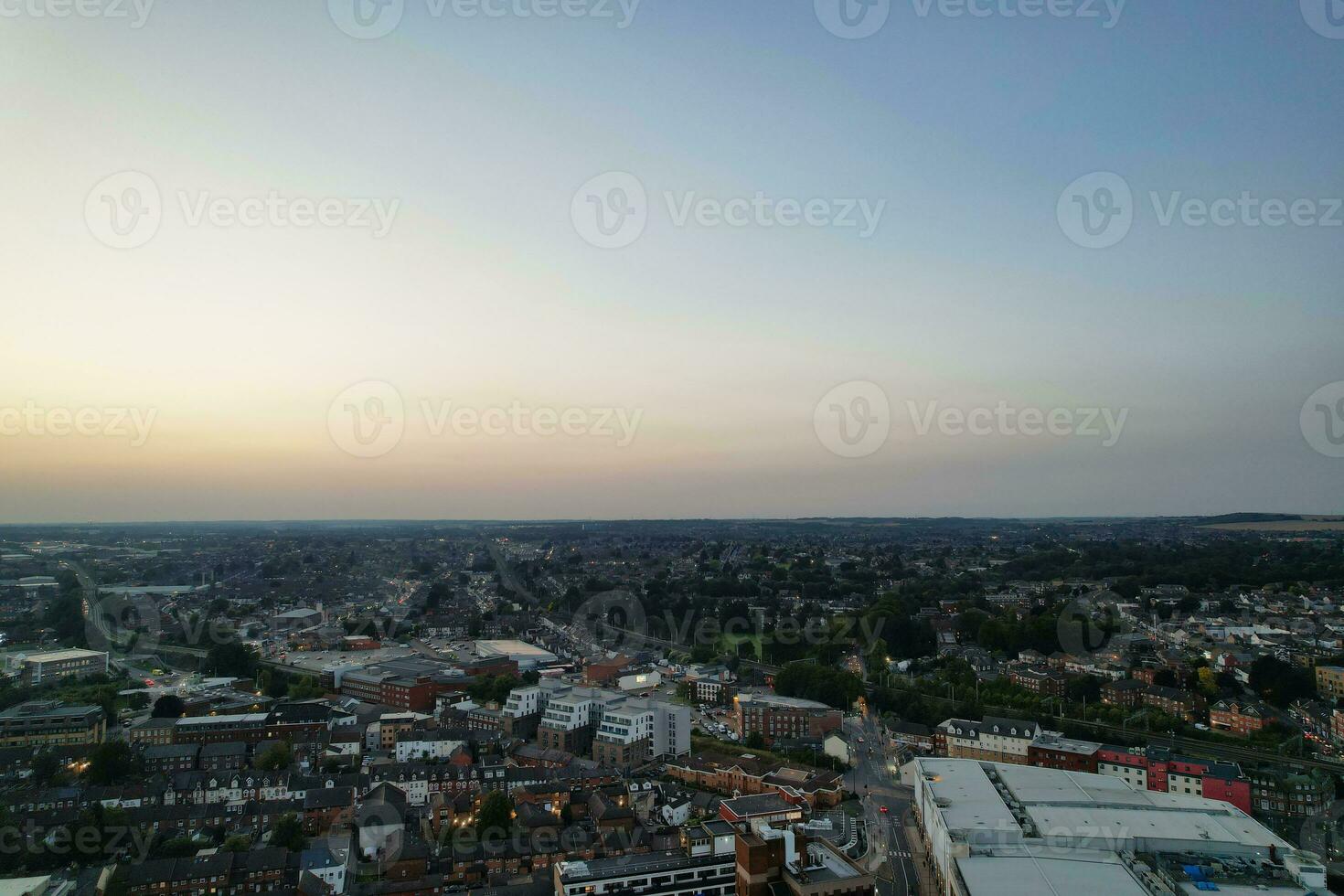 Aerial View of Illuminated Downtown Buildings, Roads and Central Luton City of England UK at Beginning of Clear Weather Night of September 5th, 2023 photo