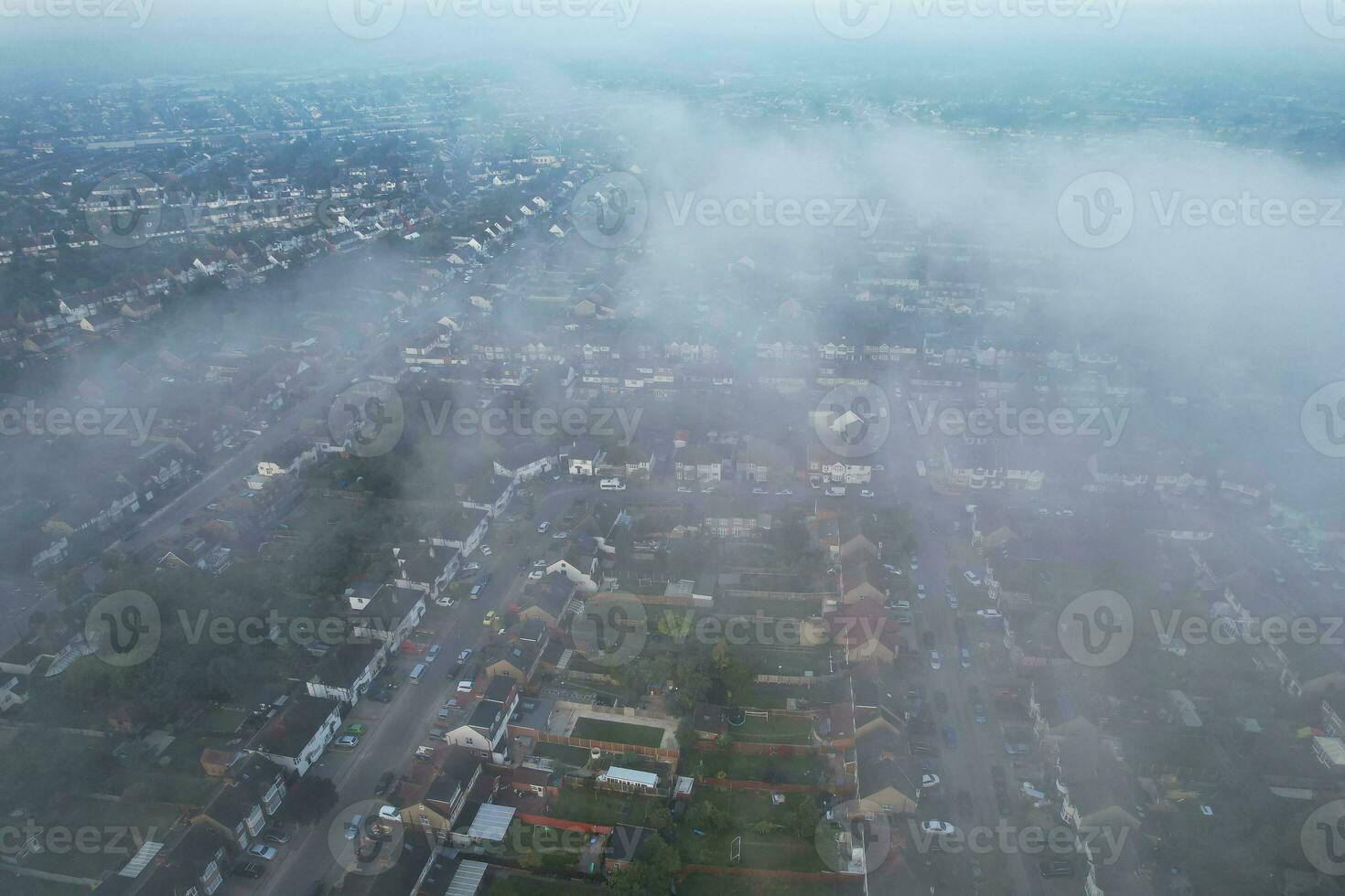 Most Beautiful and Best High Angle Dramatical Colourful Sky Footage from Above The Clouds. The Fast Moving Clouds During Sun rising Early in the Morning over Luton City of England UK photo