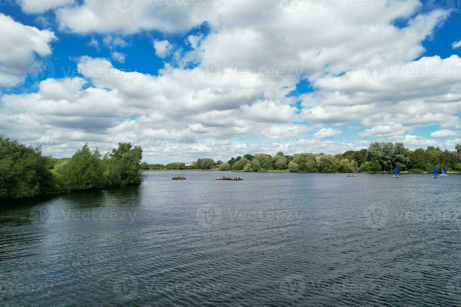 High Angle footage of People are Boating at Caldecotte Lake Located at Milton Keynes City of England Great Britain UK. The Aerial Landscape Was Captured on August 21st, 2023 with Drone's Camera photo