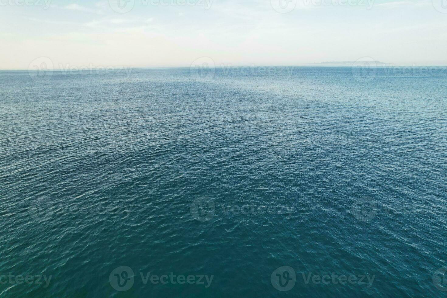 Most Beautiful View of British Landscape and Sea View of Durdle Door Beach of England Great Britain, UK. Image Was captured with Drone's camera on September 9th, 2023 photo