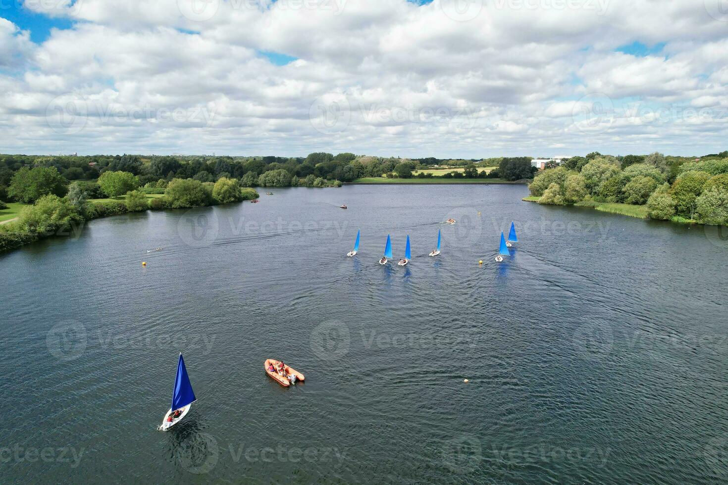 High Angle footage of People are Boating at Caldecotte Lake Located at Milton Keynes City of England Great Britain UK. The Aerial Landscape Was Captured on August 21st, 2023 with Drone's Camera photo