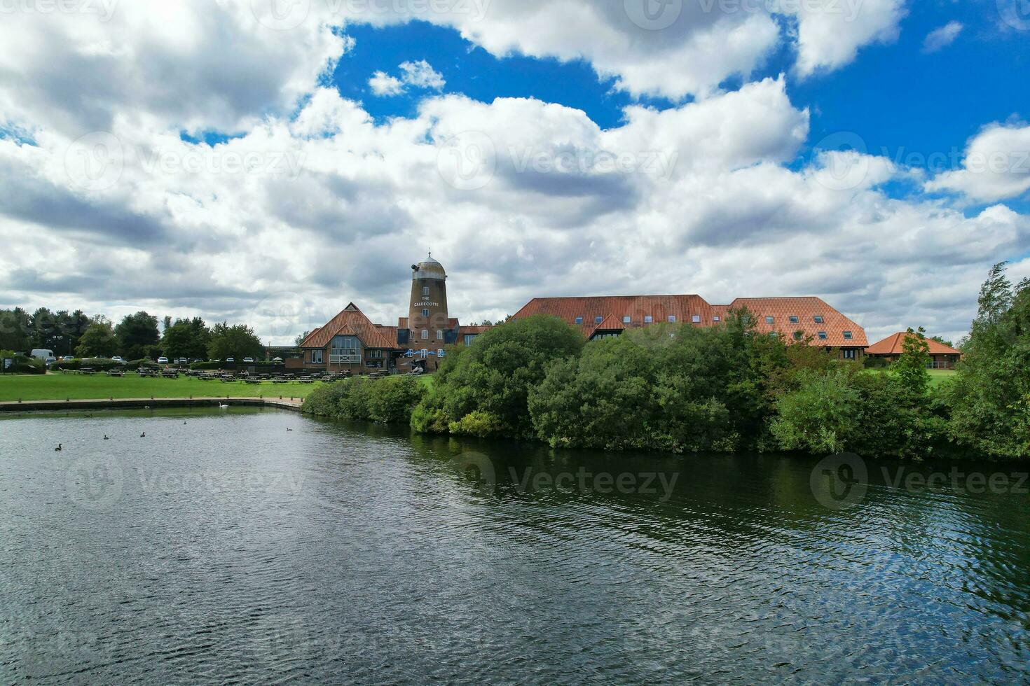 High Angle footage of People are Boating at Caldecotte Lake Located at Milton Keynes City of England Great Britain UK. The Aerial Landscape Was Captured on August 21st, 2023 with Drone's Camera photo