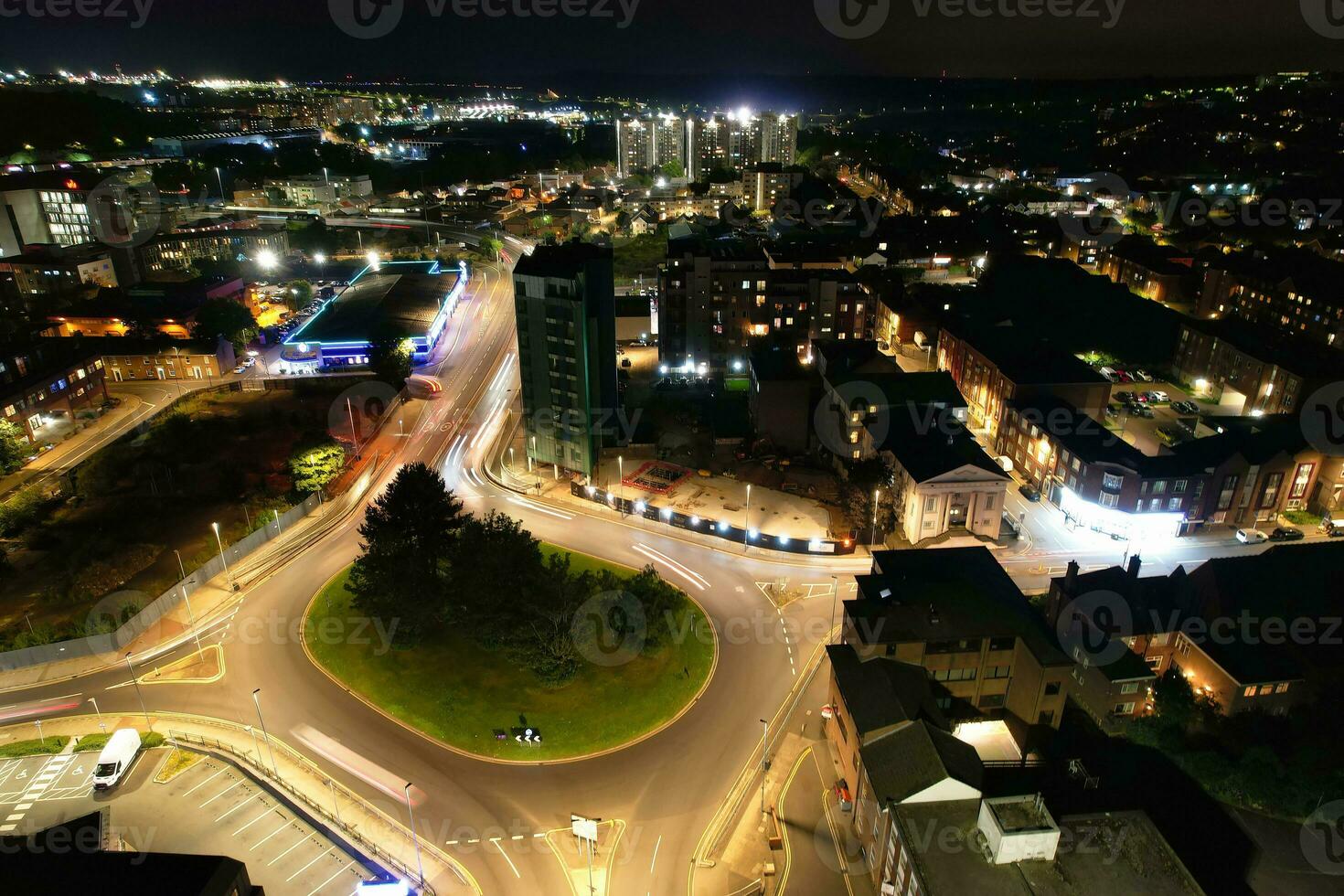 Aerial View of Illuminated Downtown Buildings, Roads and Central Luton City of England UK at Beginning of Clear Weather Night of September 5th, 2023 photo