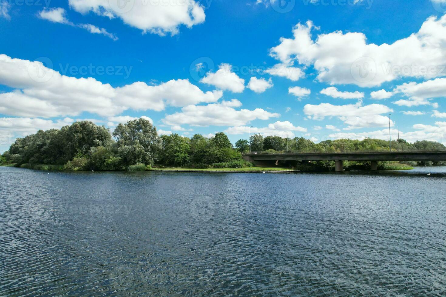 High Angle footage of People are Boating at Caldecotte Lake Located at Milton Keynes City of England Great Britain UK. The Aerial Landscape Was Captured on August 21st, 2023 with Drone's Camera photo