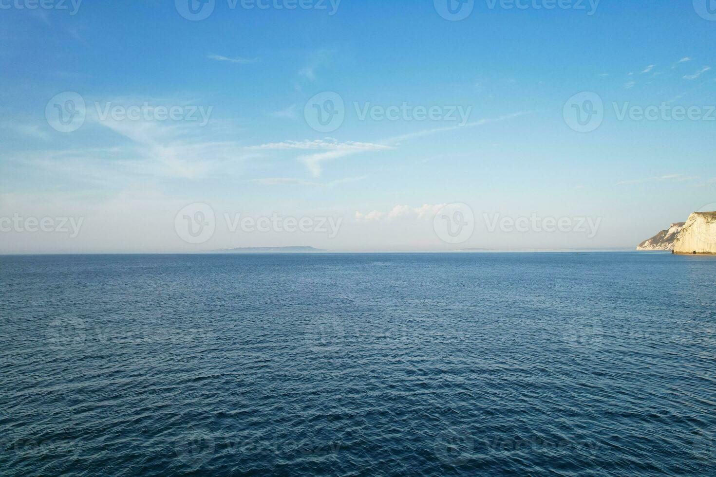Most Beautiful View of British Landscape and Sea View of Durdle Door Beach of England Great Britain, UK. Image Was captured with Drone's camera on September 9th, 2023 photo