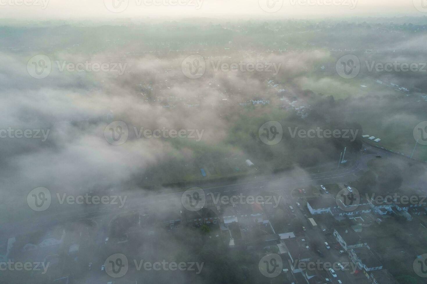 Most Beautiful and Best High Angle Dramatical Colourful Sky Footage from Above The Clouds. The Fast Moving Clouds During Sun rising Early in the Morning over Luton City of England UK photo