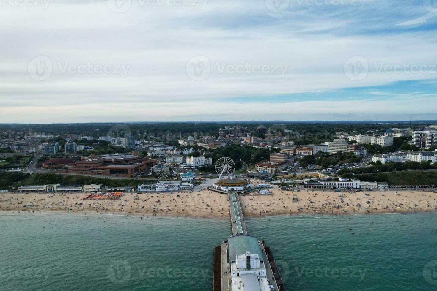 Aerial View of Most Beautiful and Attractive Tourist Destination at Bournemouth City Sandy Beach of England Great Britain, Image Was Captured with Drone's Camera on August 23rd, 2023 During sunny Day. photo