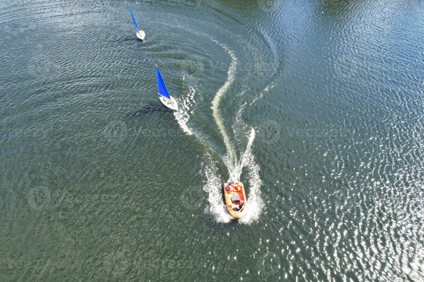 High Angle footage of People are Boating at Caldecotte Lake Located at Milton Keynes City of England Great Britain UK. The Aerial Landscape Was Captured on August 21st, 2023 with Drone's Camera photo