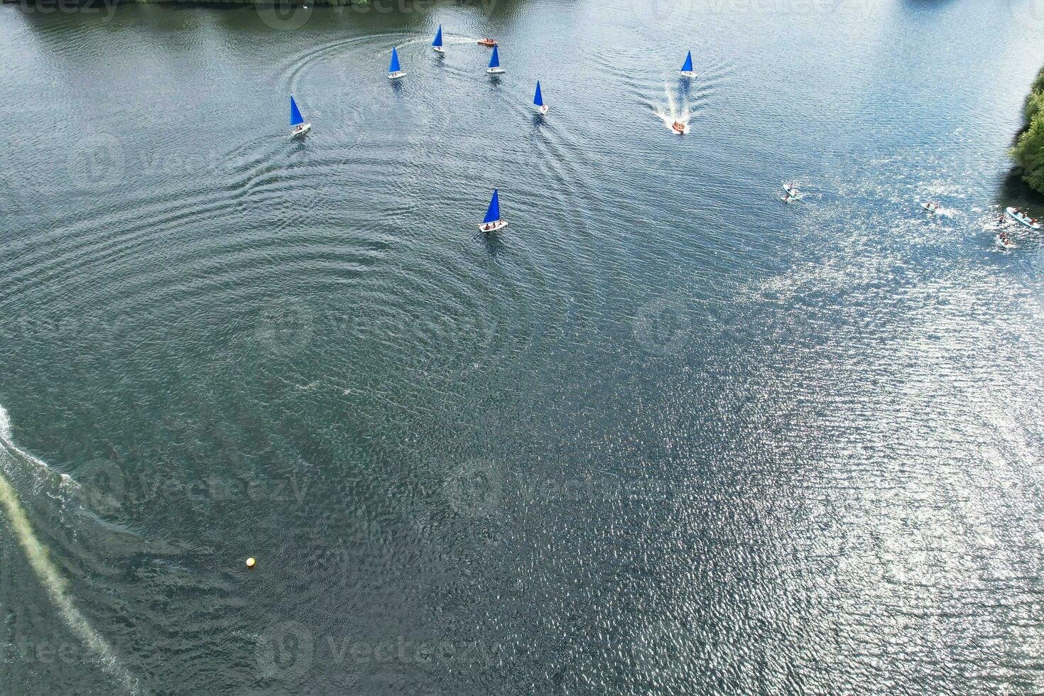 High Angle footage of People are Boating at Caldecotte Lake Located at Milton Keynes City of England Great Britain UK. The Aerial Landscape Was Captured on August 21st, 2023 with Drone's Camera photo