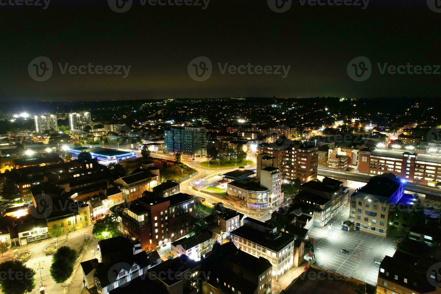 Aerial View of Illuminated Downtown Buildings, Roads and Central Luton City of England UK at Beginning of Clear Weather Night of September 5th, 2023 photo