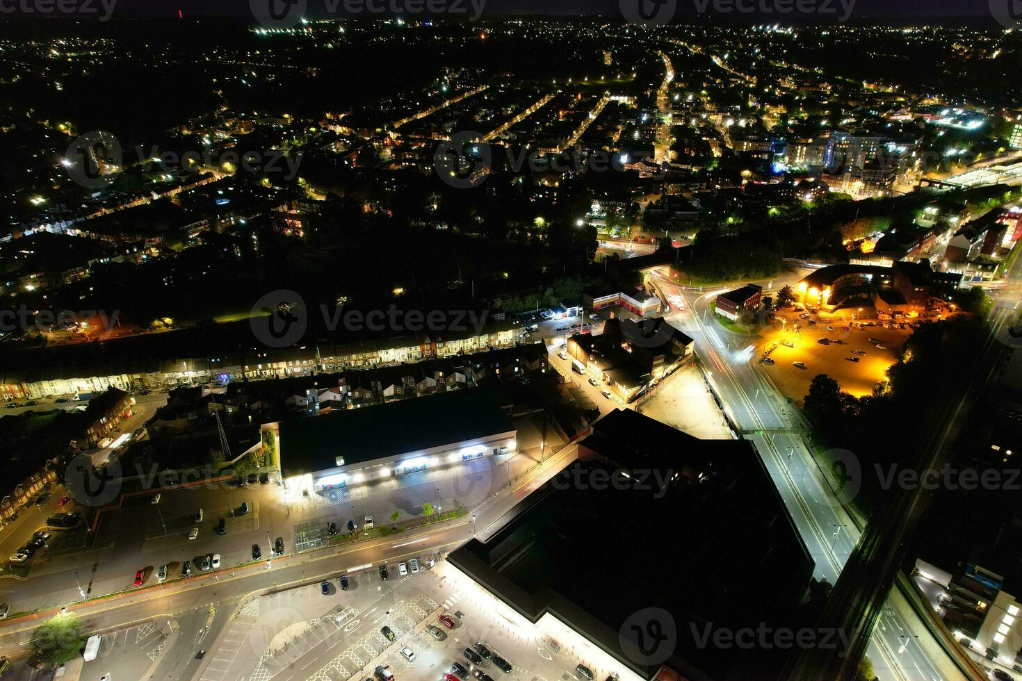 Aerial View of Illuminated Downtown Buildings, Roads and Central Luton City of England UK at Beginning of Clear Weather Night of September 5th, 2023 photo