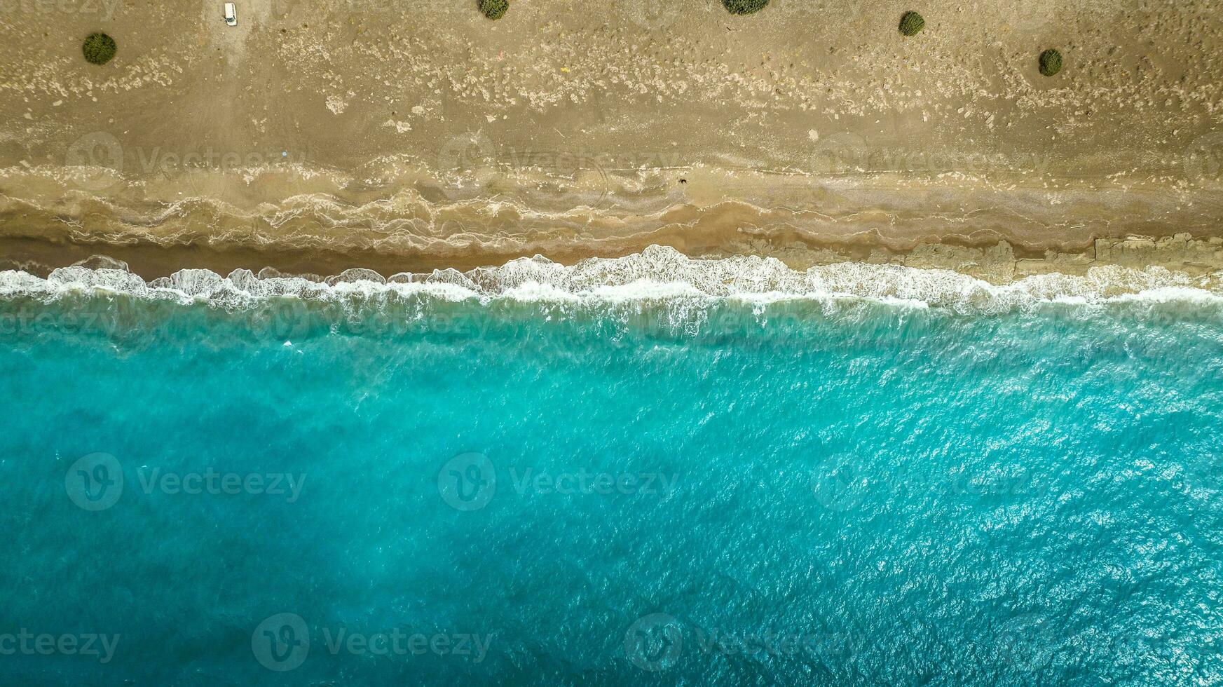 Clear water by the beach in Rhodes near Lindos, Greece photo