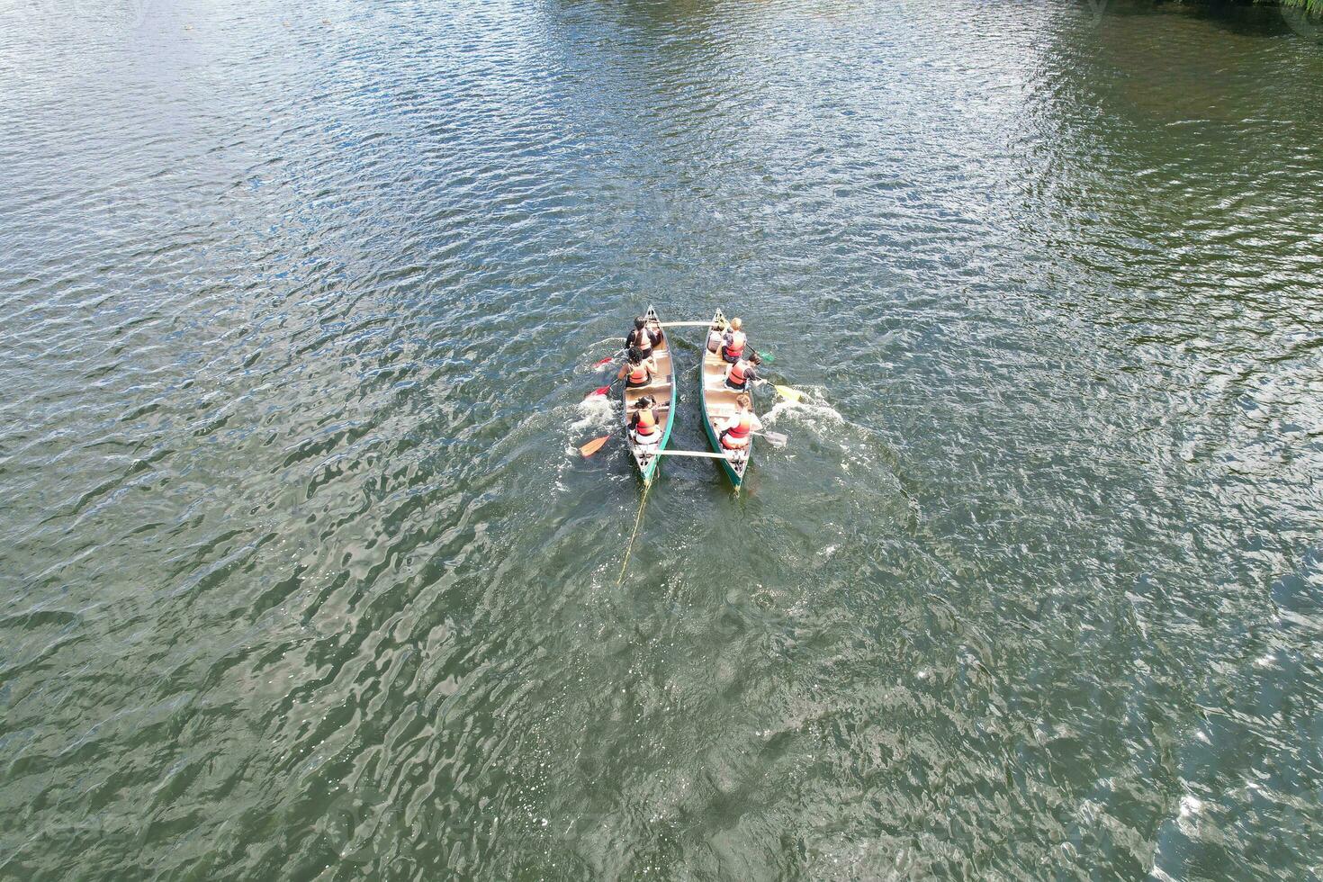 High Angle footage of People are Boating at Caldecotte Lake Located at Milton Keynes City of England Great Britain UK. The Aerial Landscape Was Captured on August 21st, 2023 with Drone's Camera photo