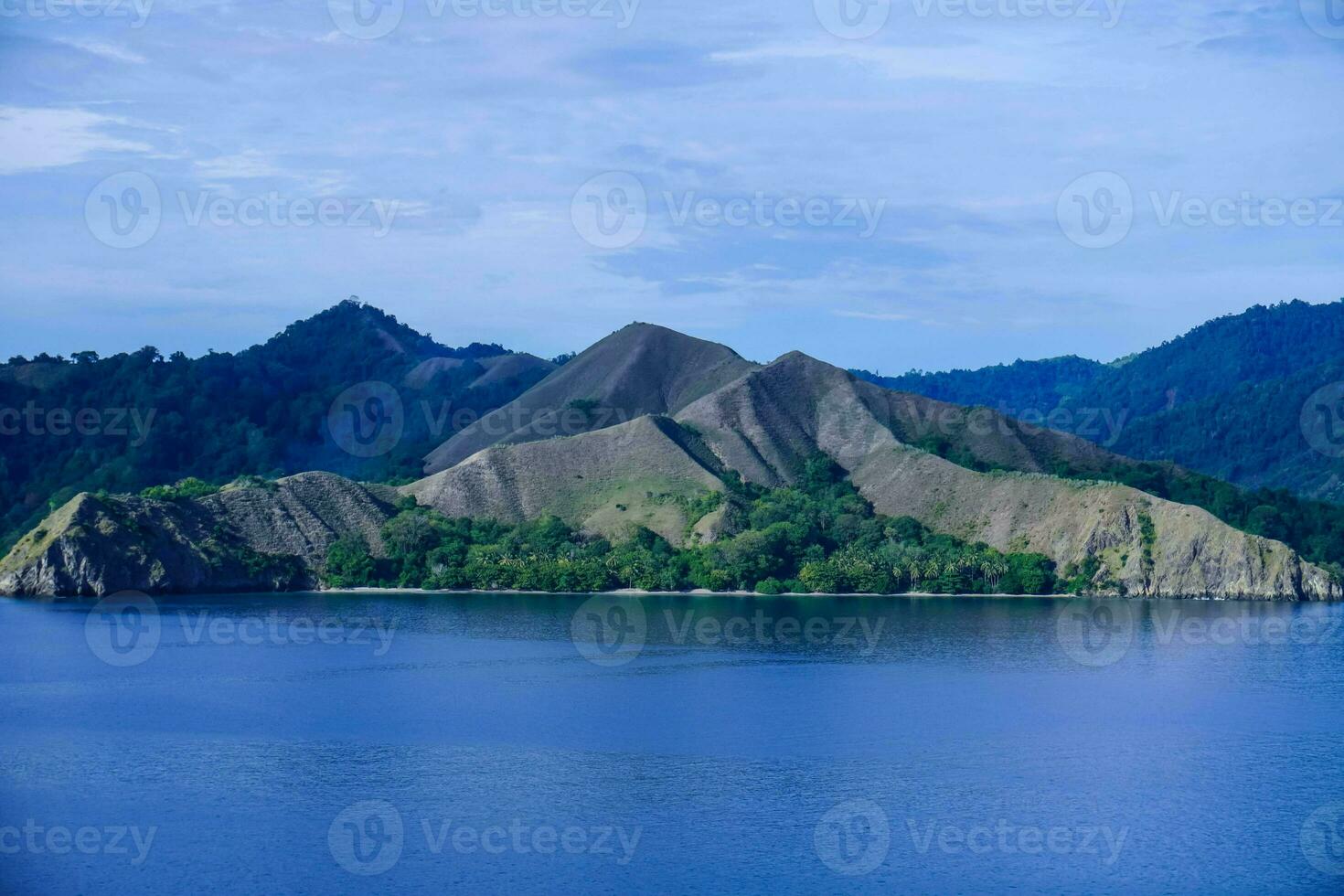 Beautiful view of Pulo Dua Balantak hill, view of blue sea and white clouds with blue sky located in the Banggai district of Central Sulawesi, Indonesia photo