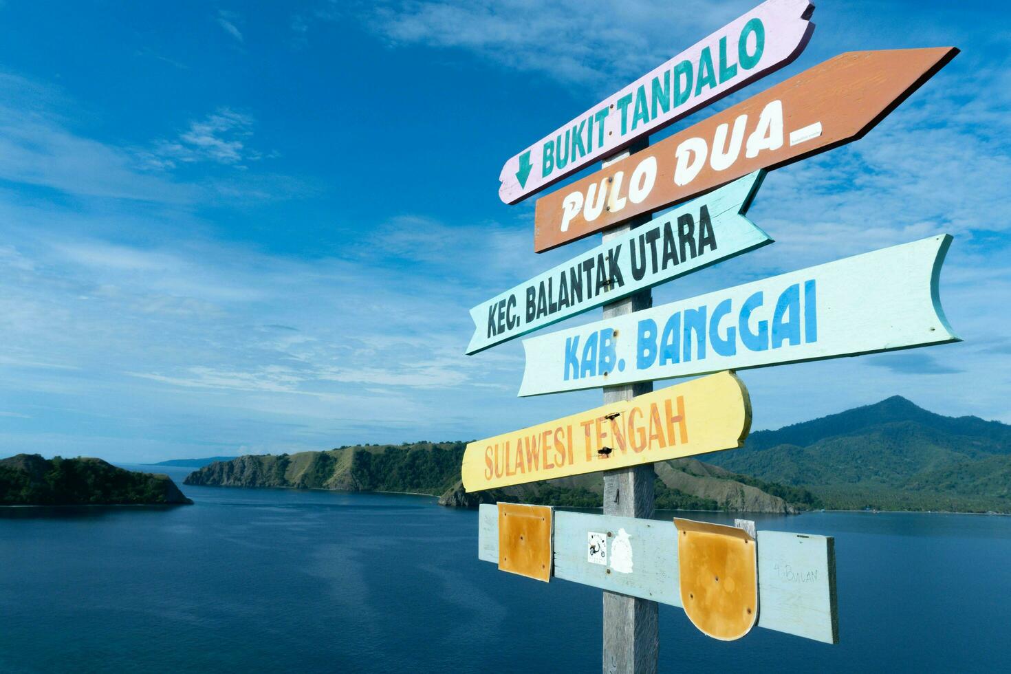 Banggai, Indonesia - November 2022, Beautiful view of Pulo Dua Balantak hill, view of blue sea and white clouds with blue sky located in the Banggai district of Central Sulawesi, Indonesia photo