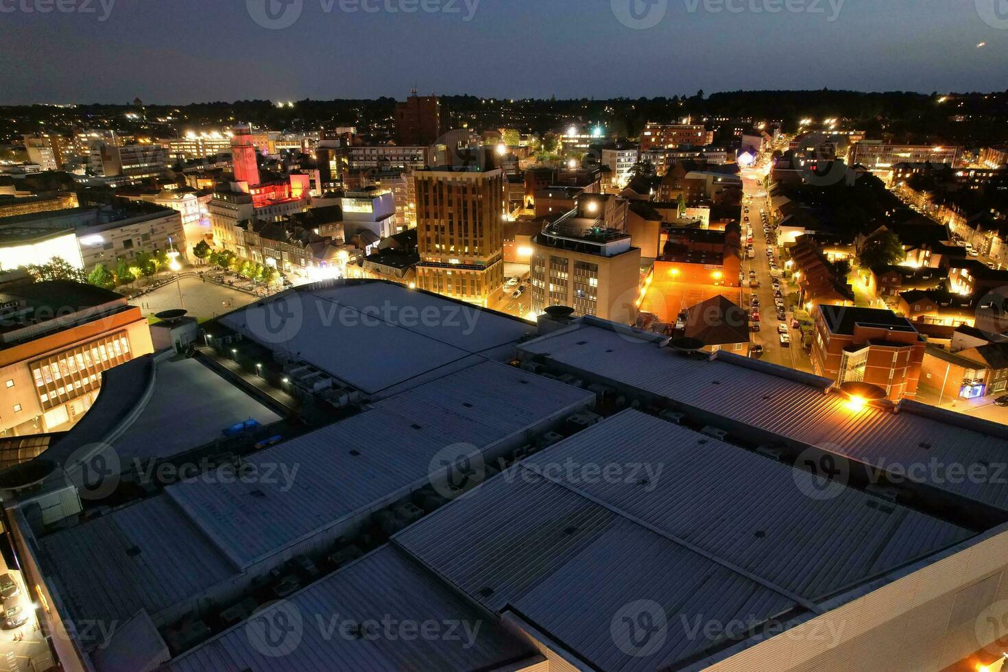 Aerial View of Illuminated Downtown Buildings, Roads and Central Luton City of England UK at Beginning of Clear Weather Night of September 5th, 2023 photo