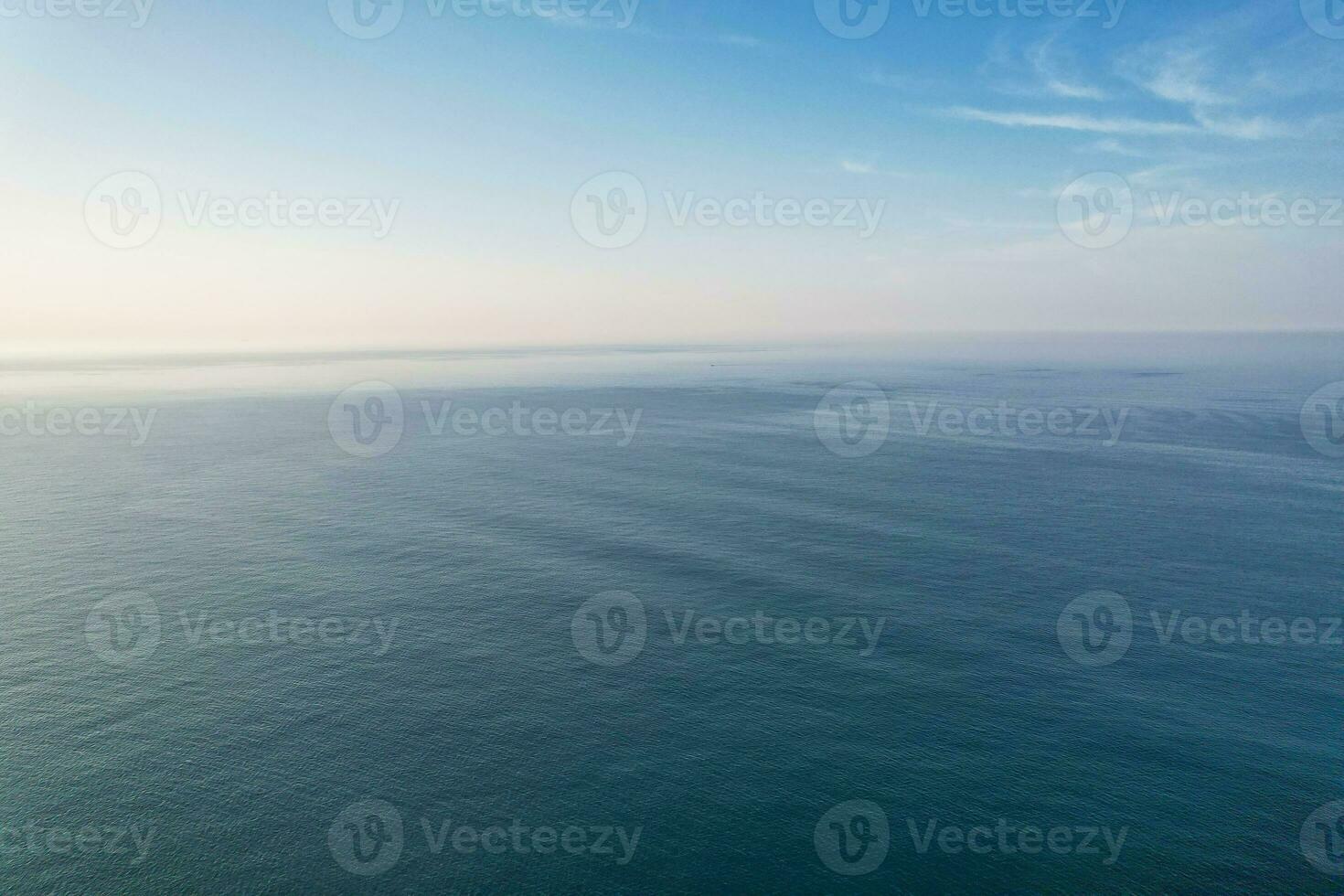Most Beautiful View of British Landscape and Sea View of Durdle Door Beach of England Great Britain, UK. Image Was captured with Drone's camera on September 9th, 2023 photo