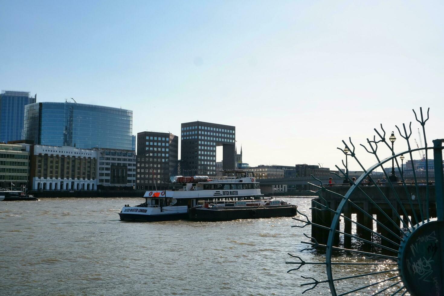 Best View of Boat over River Thames Waters at London Bridge, Capital City of England Great Britain. The Image Was Captured June 4th, 2023 photo