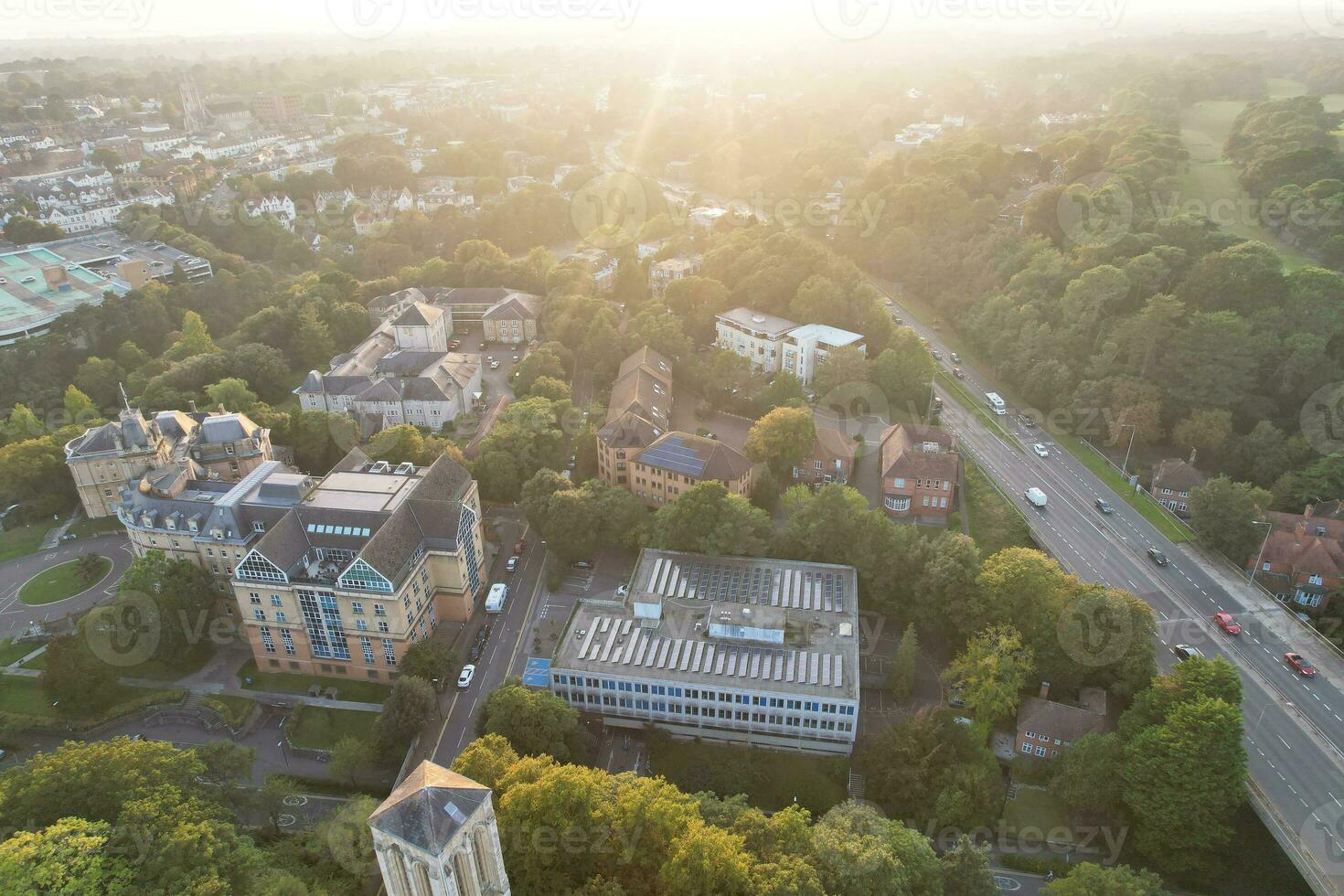 Aerial View of British Tourist Attraction of Bournemouth Beach and Sea view City of England Great Britain UK. Image Captured with Drone's Camera on September 9th, 2023 During Sunset photo