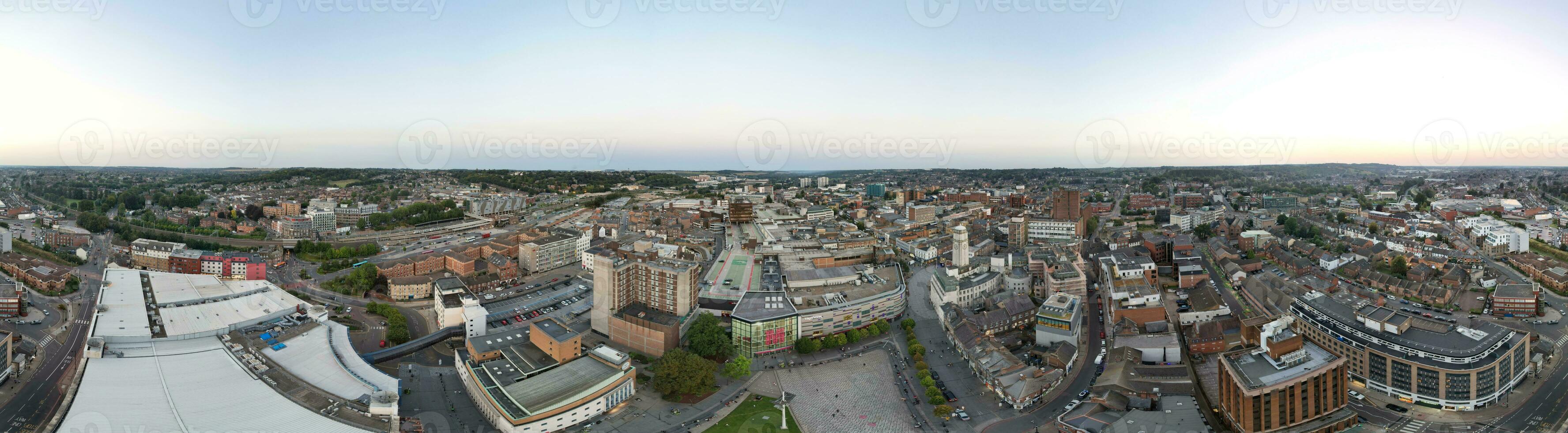 Ultra Wide Aerial Panoramic View of Illuminated Downtown Buildings, Roads and Central Luton City of England UK at Beginning of Clear Weather's Night of September 5th, 2023 photo
