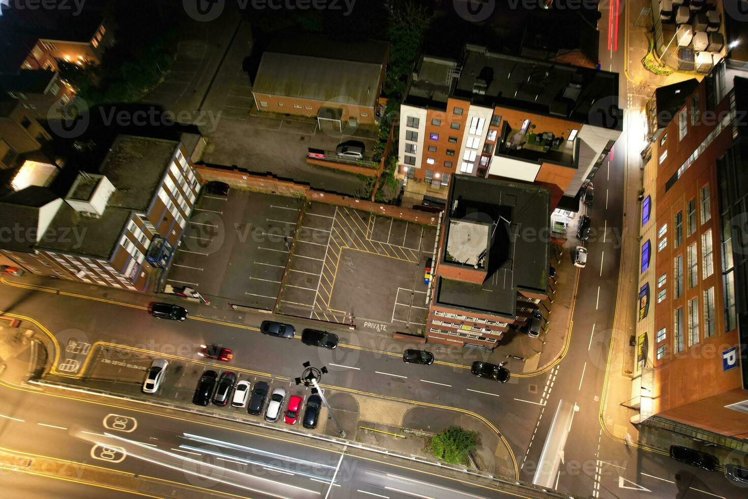 Aerial View of Illuminated Downtown Buildings, Roads and Central Luton City of England UK at Beginning of Clear Weather Night of September 5th, 2023 photo