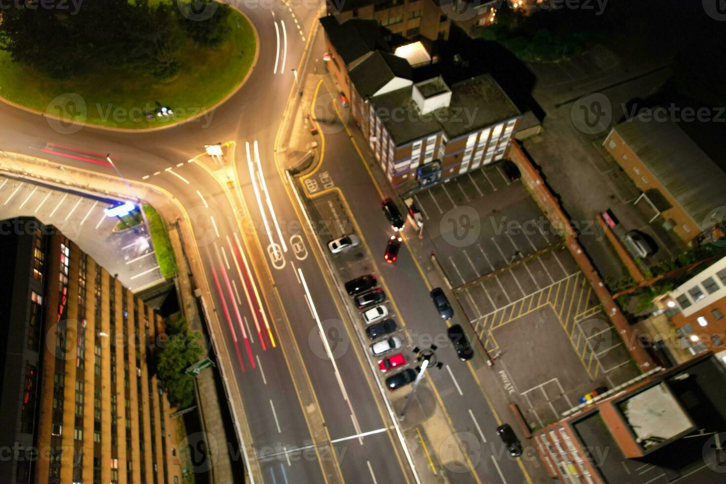 Aerial View of Illuminated Downtown Buildings, Roads and Central Luton City of England UK at Beginning of Clear Weather Night of September 5th, 2023 photo